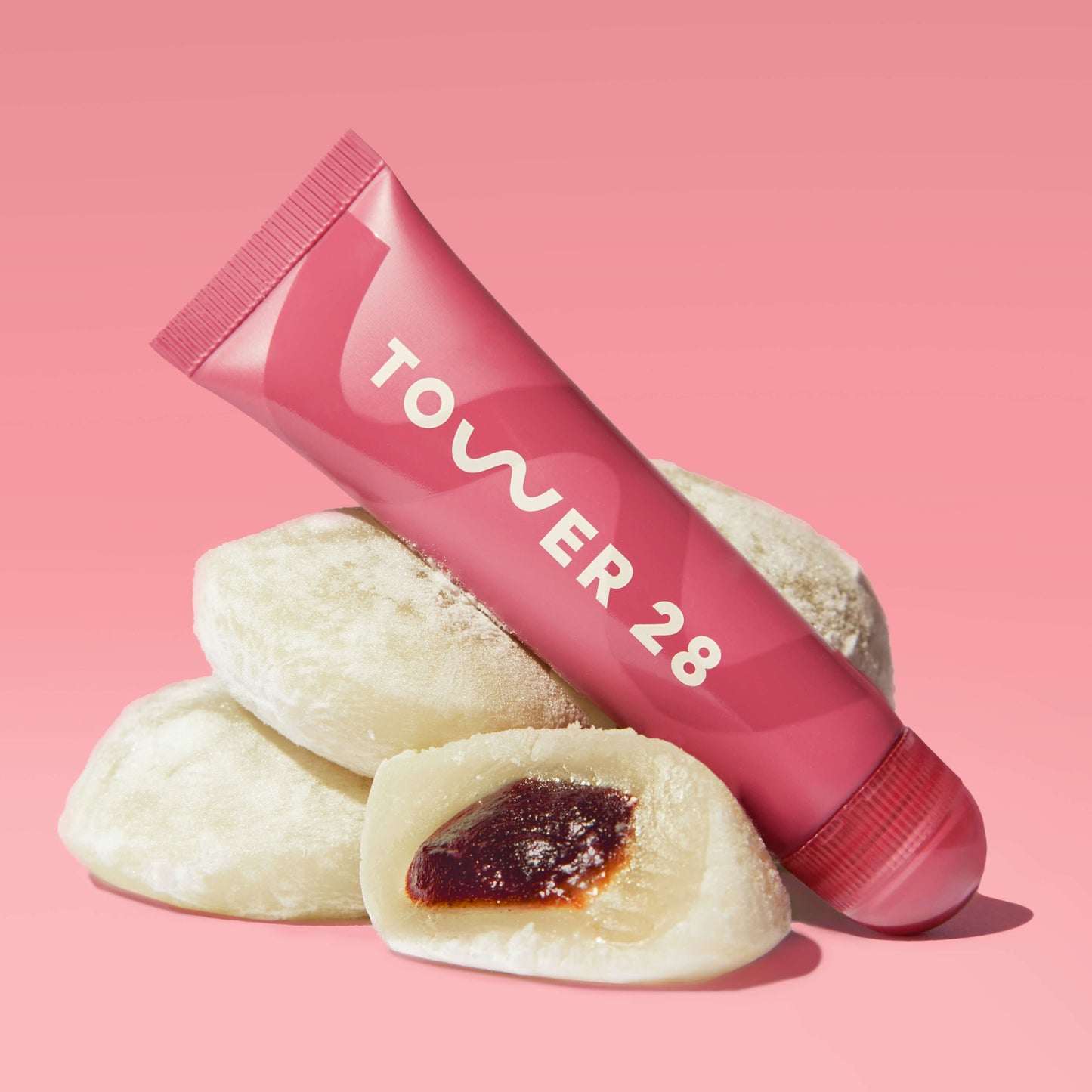 Red Bean Mochi [A close up of Tower 28 Beauty's LipSoftie® Lip Treatment in Red Bean Mochi]