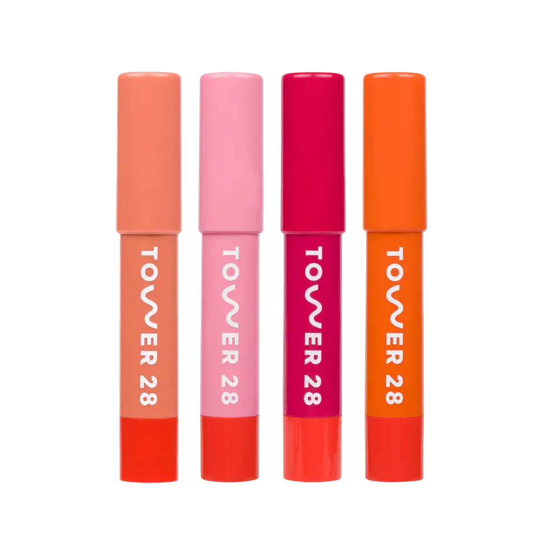 JuiceBalm Lip Balm Set [Shared: A close up of all four shades in Tower 28 Beauty's JuiceBalm Set: Drink, Shake, Mix, and Squeeze.]