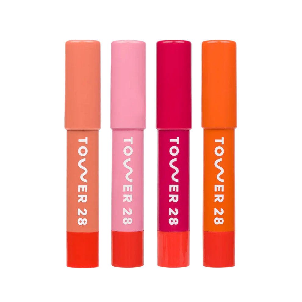 Shared: A close up of all four shades in Tower 28 Beauty's JuiceBalm Set: Drink, Shake, Mix, and Squeeze.