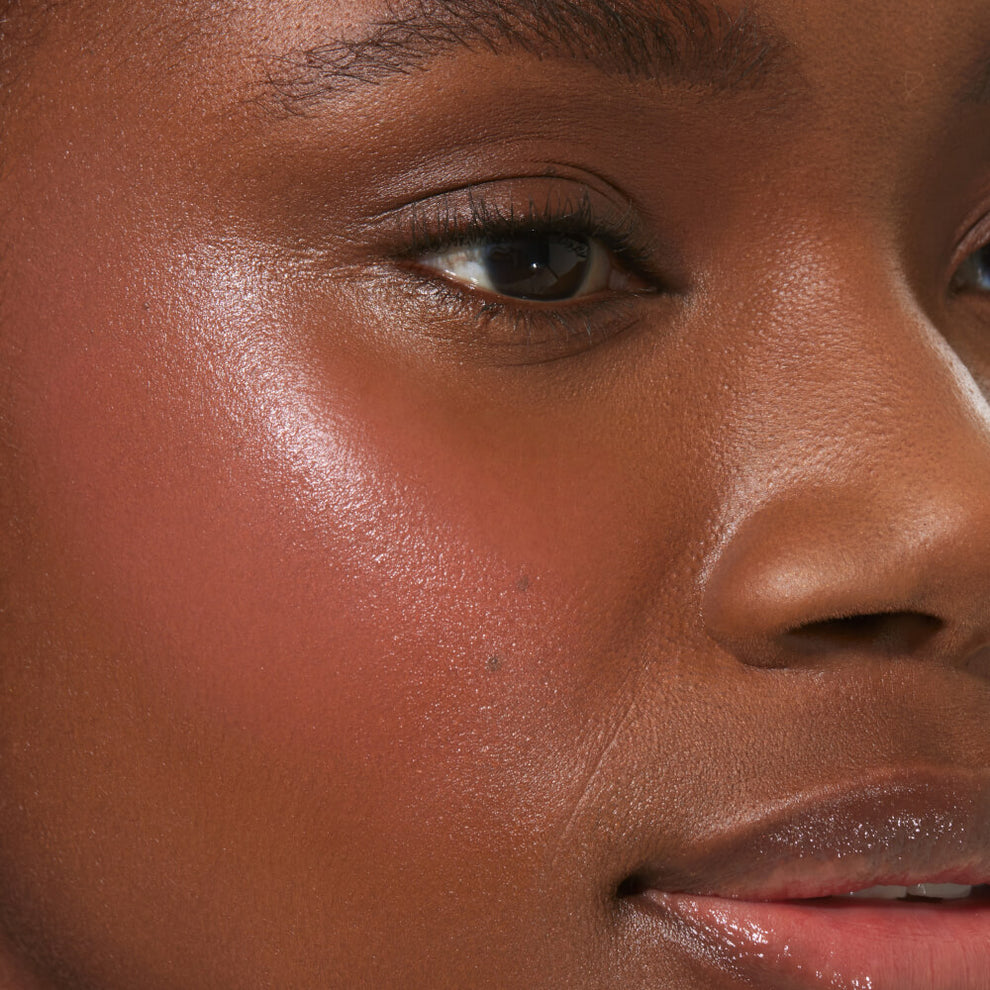 A close up of a model with Tower 28 Beauty's BeachPlease Cream Blush in Office Hours on her face.