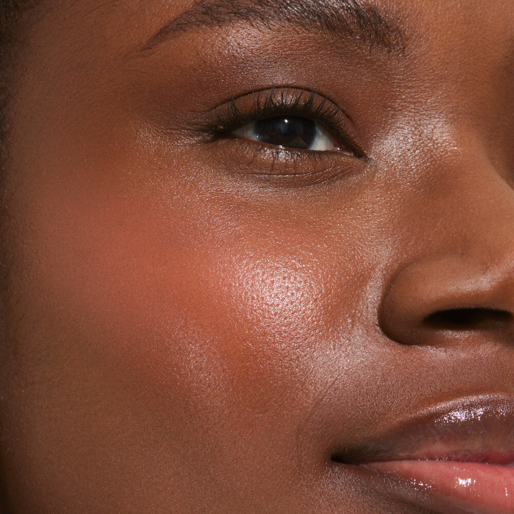 Rush Hour [A close up of a model with Tower 28 Beauty's BeachPlease Cream Blush in Rush Hour on her face.]