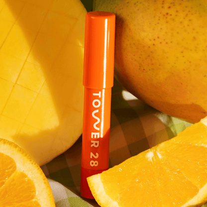 Shade: Squeeze [Tower 28 Beauty's JuiceBalm Lip Balm in the shade Squeeze]